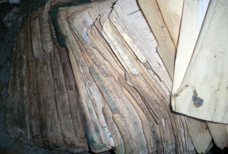 Damaged documents before TERS provides document restoration services